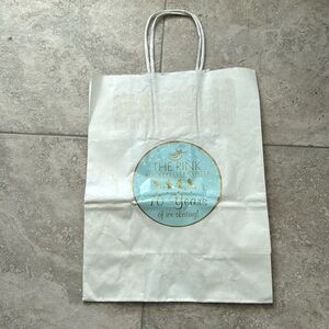 The Rink Rockefeller Center 70 Years of ice skating souvenir bag.